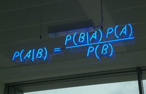  blue neon sign, showing the simple statement of Bayes’ theorem